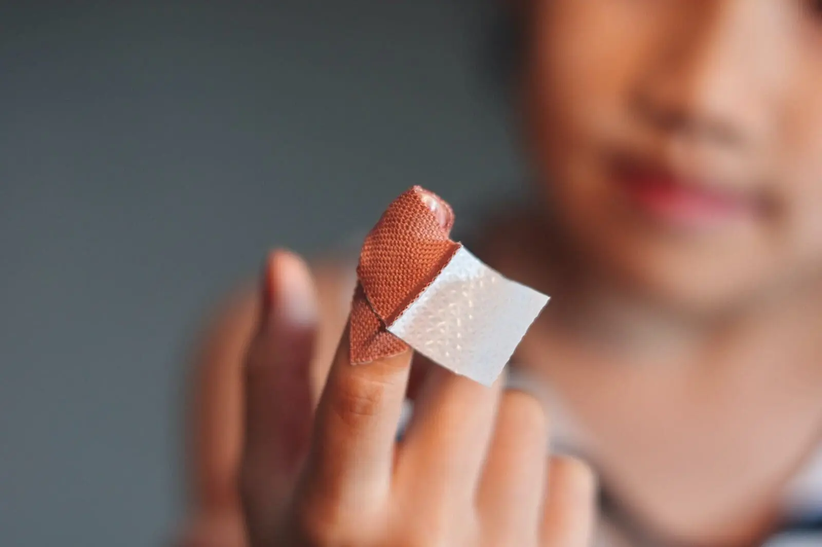 Girl first aid finger injury by herself