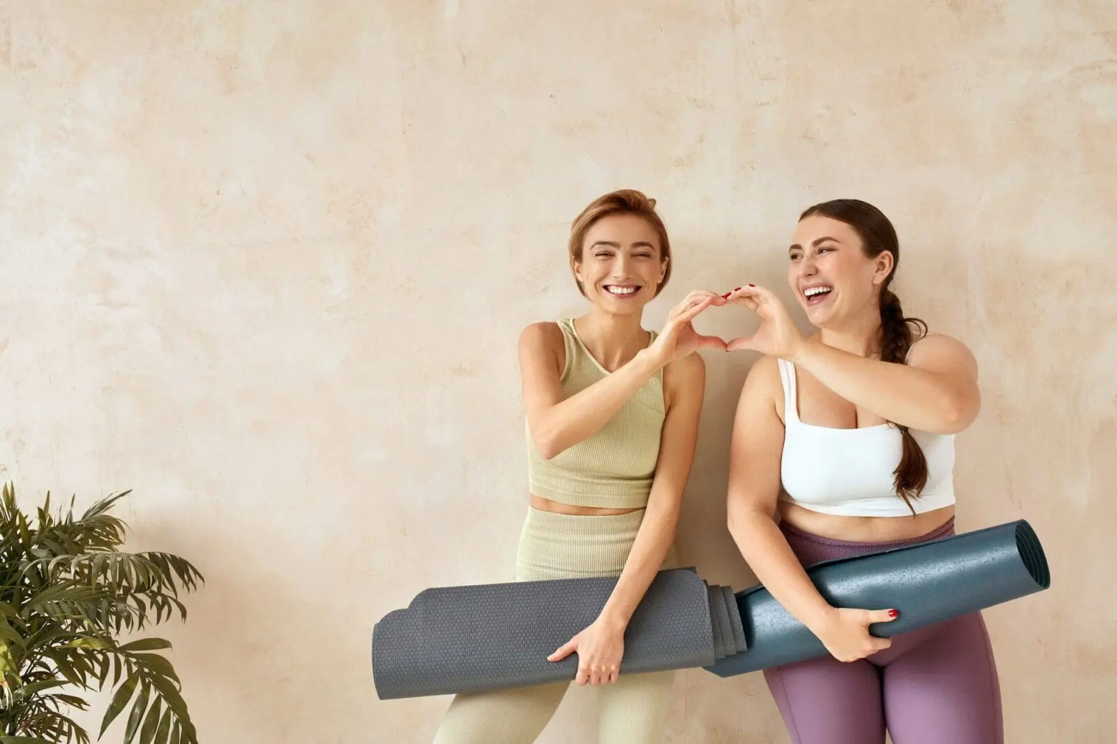 Laughing Women Posing After Yoga. Female Friends Laughing