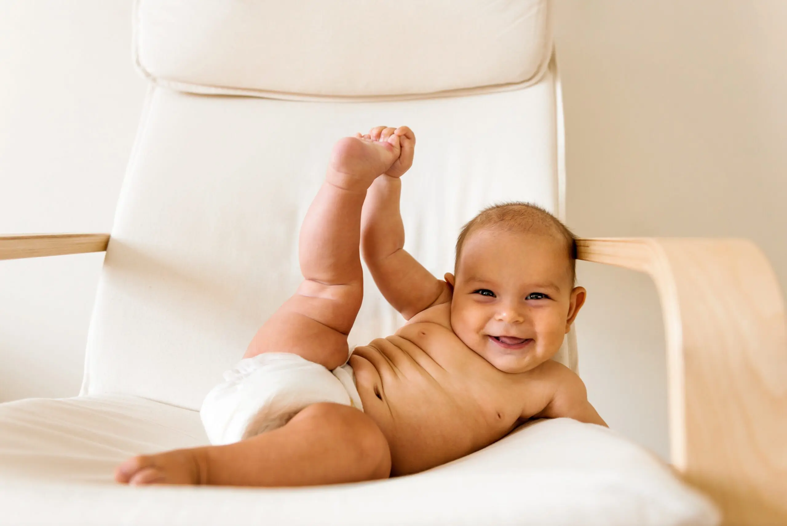 Funny cute baby doing yoga fitness