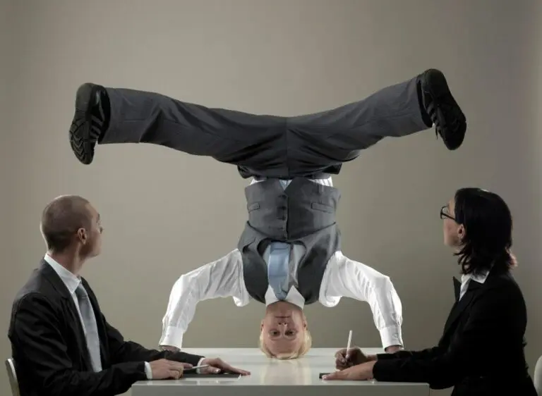 Business man standing on head