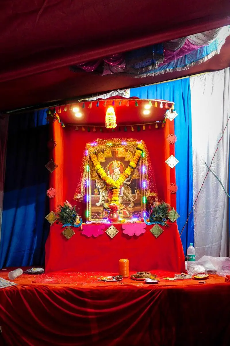 hindu deity figurine on red table