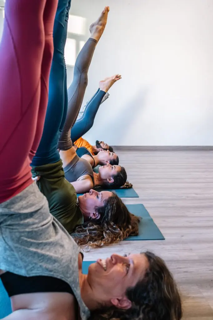 Group doing Salamba Sarvangasana pose together