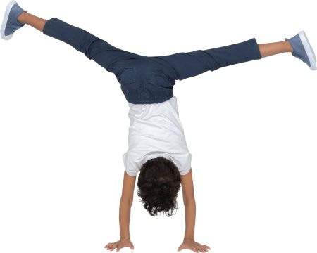 a boy doing a handstand on his hands��